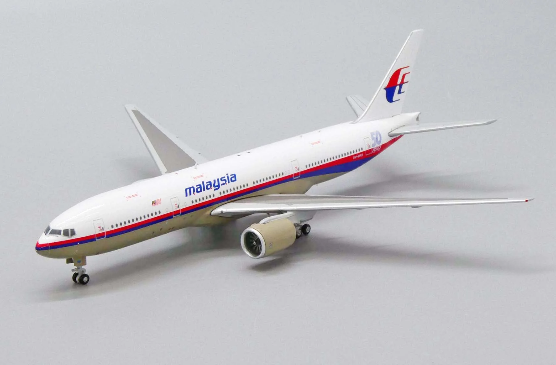 *1/400 Malaysia Airlines B 777-200ER "50 Years 1947-1997" JC Wings JC4MAS488 - Image 4